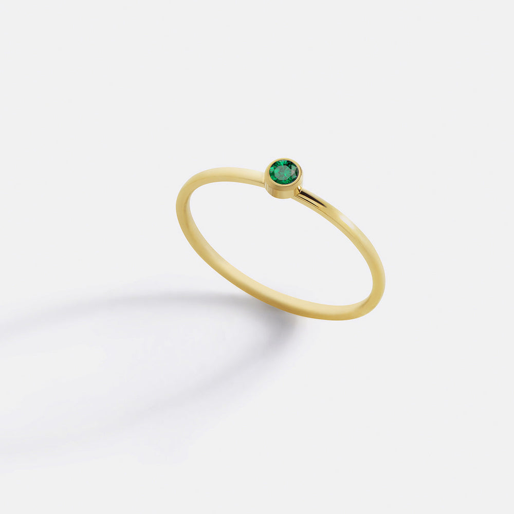https://cdn.shopify.com/s/files/1/1342/2527/files/Minimalist_birthstone_stacking_band_1-may-gold.jpg?v=1731511842