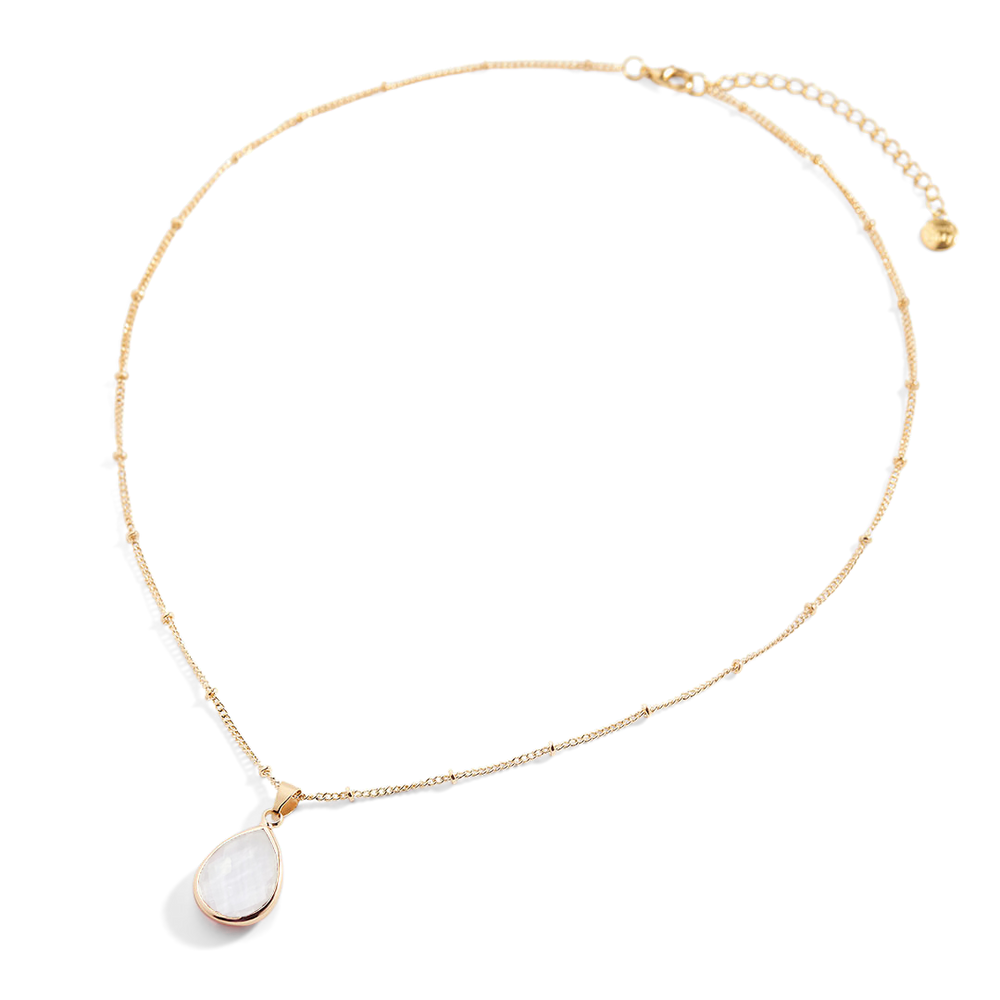 Gold necklace with a teardrop-shaped pendant on a light gray background