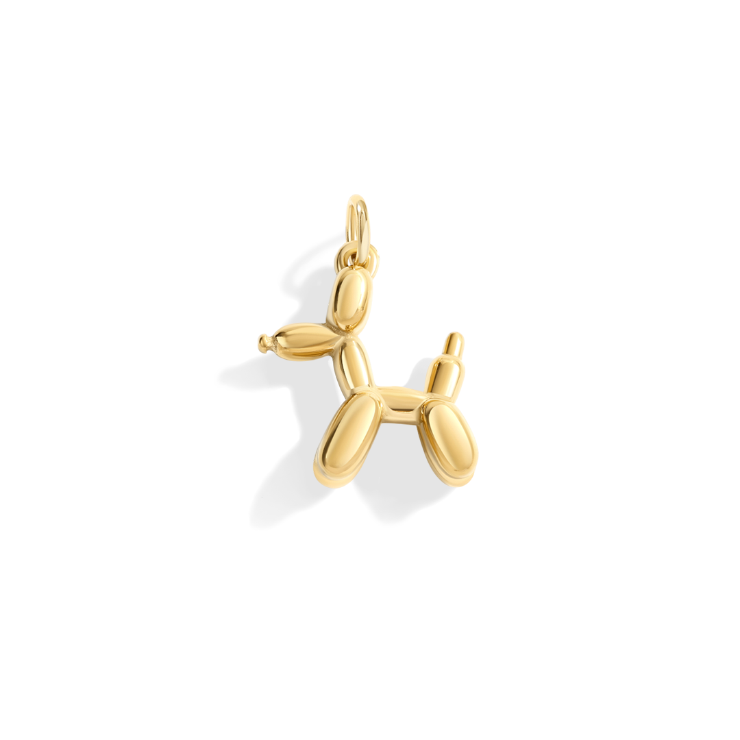 Gold balloon dog pendant on a white background