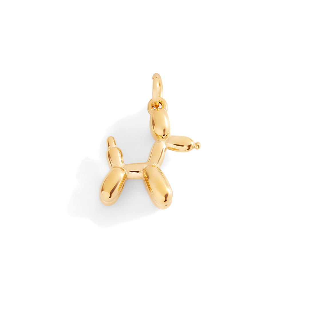 Gold balloon dog pendant on a white background