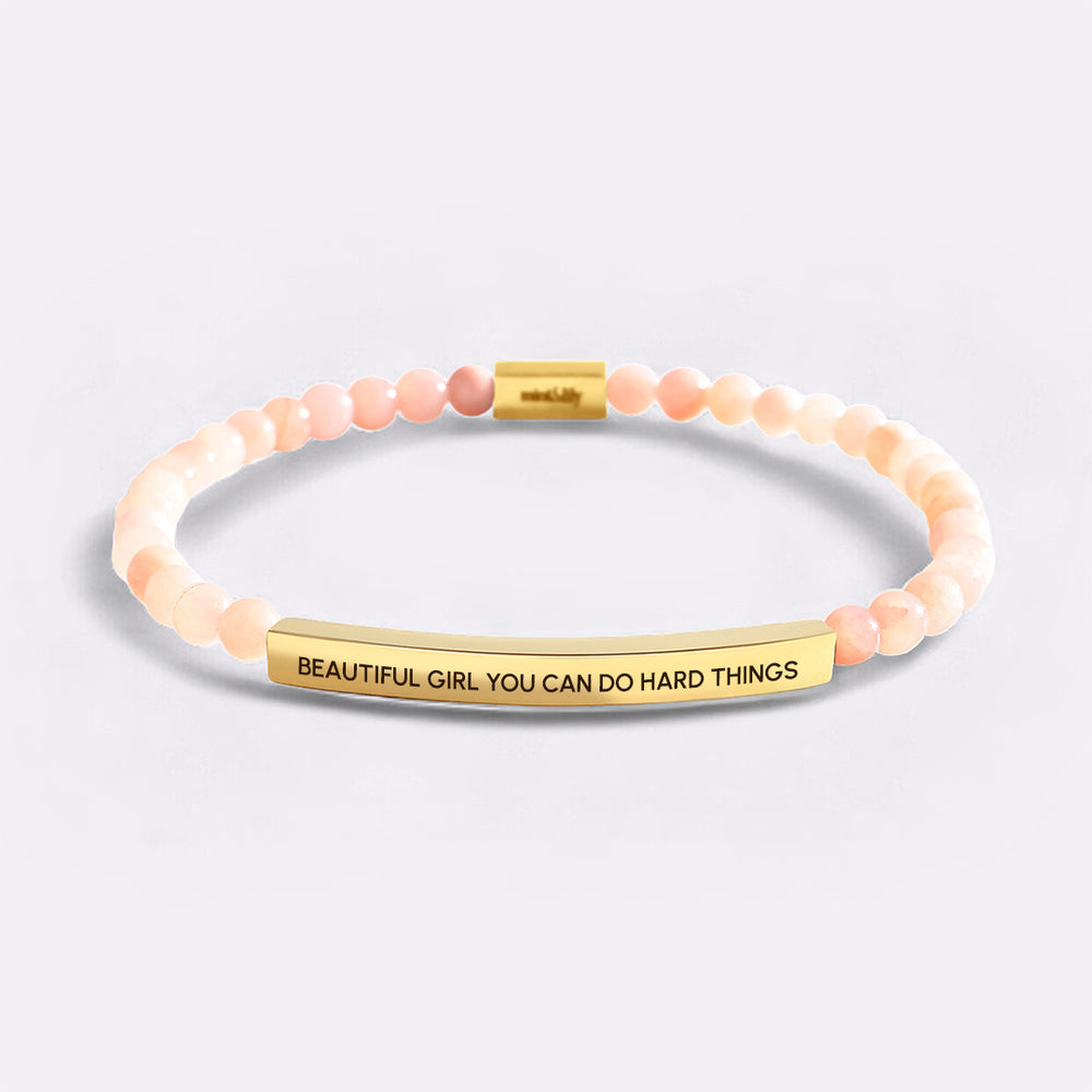 Bracelet with motivational message on a light gray background
