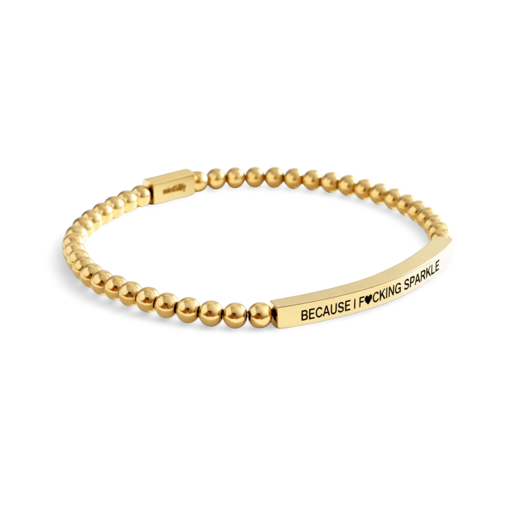 Gold beaded bracelet with a motivational message on a white background