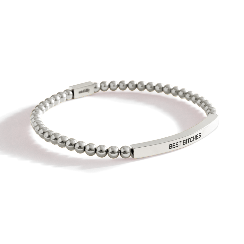 Silver beaded bracelet with engraved text on a white background