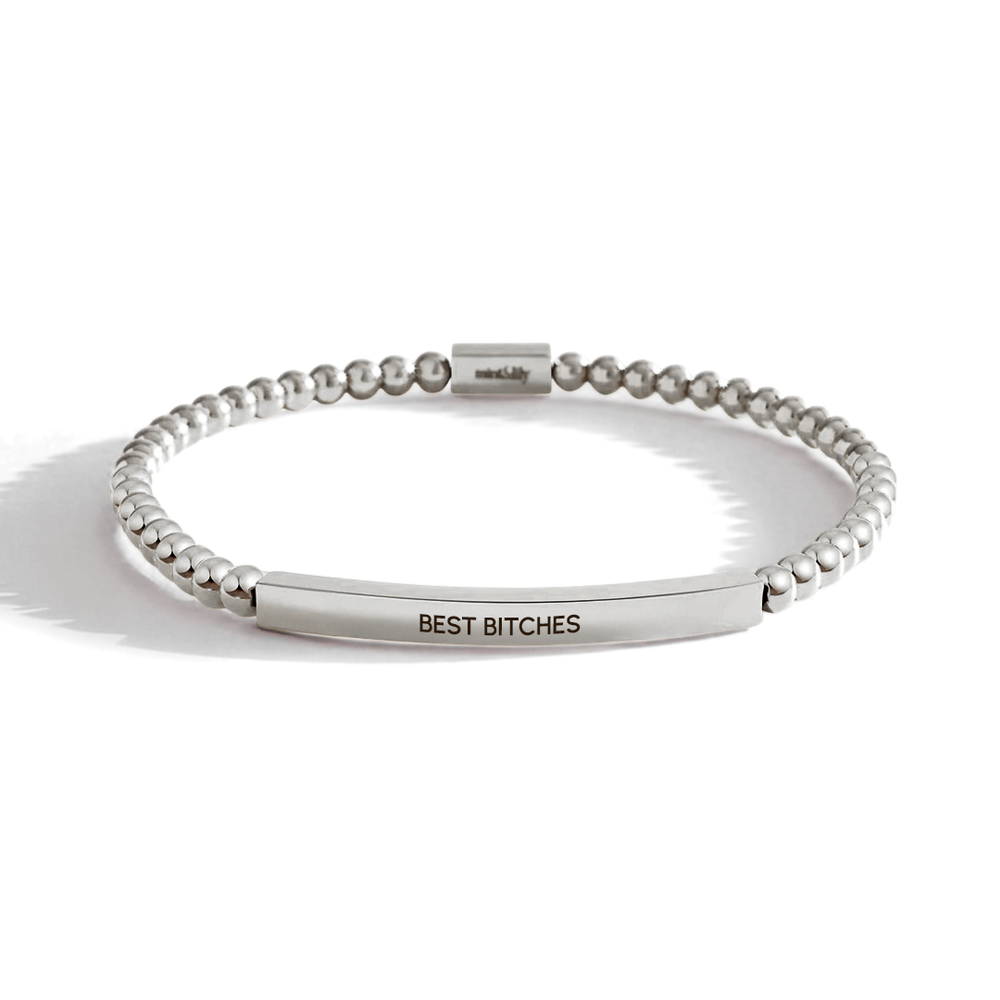 Silver beaded bracelet with engraved 'BEST BITCHES' on a white background
