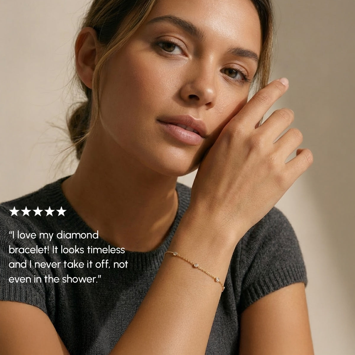 Woman wearing a diamond bracelet with a neutral background