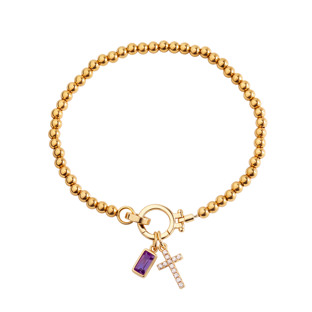 Cross Charm Birthstone Bracelet with gold beaded chain, cross charm and June alexandrite birthstone charm on a white background.