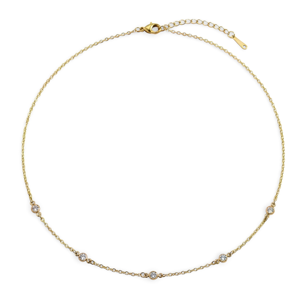 Gold necklace with small diamonds on a white background