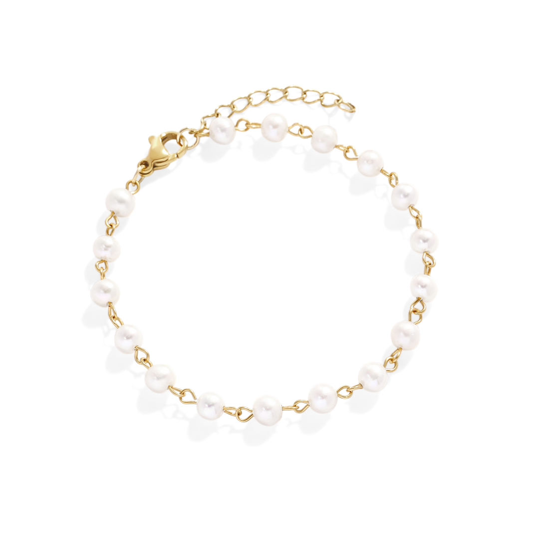 Bracelet with white beads and gold chain on a light gray background