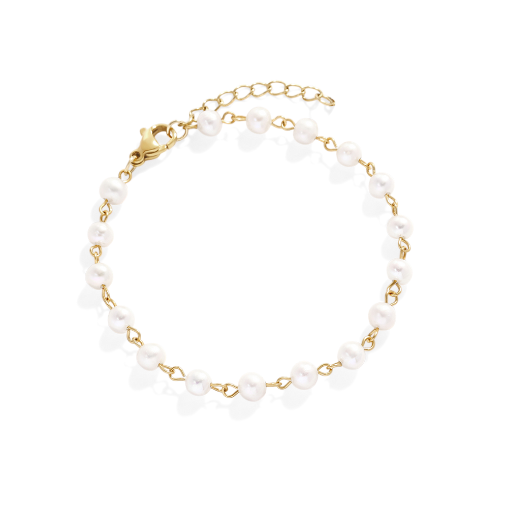 Bracelet with white beads and gold chain on a light gray background