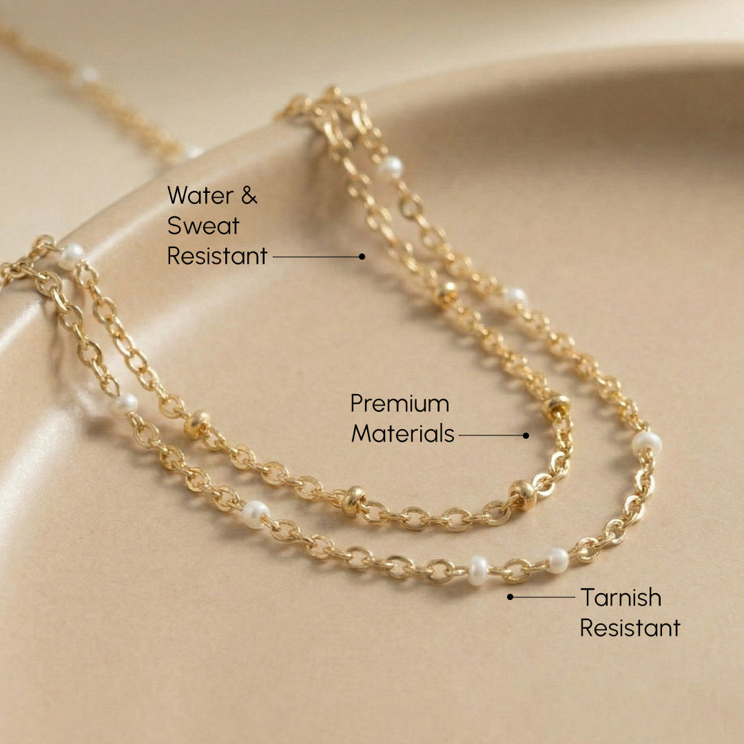 Gold chain necklace on a beige background with text highlighting features