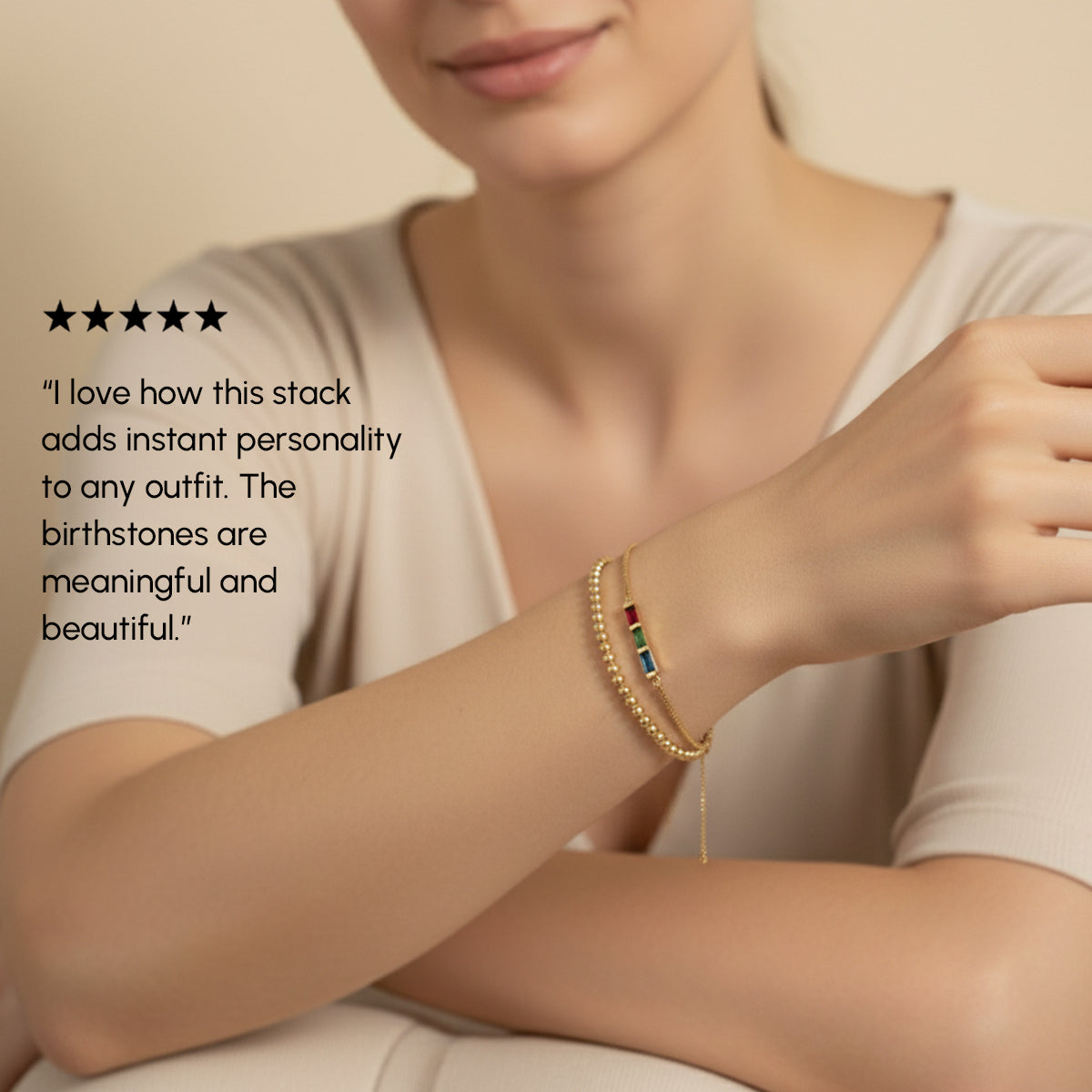 Person wearing a gold bracelet with birthstones, text overlay about jewelry satisfaction.
