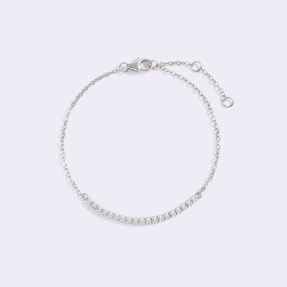 Silver bracelet on a light gray background