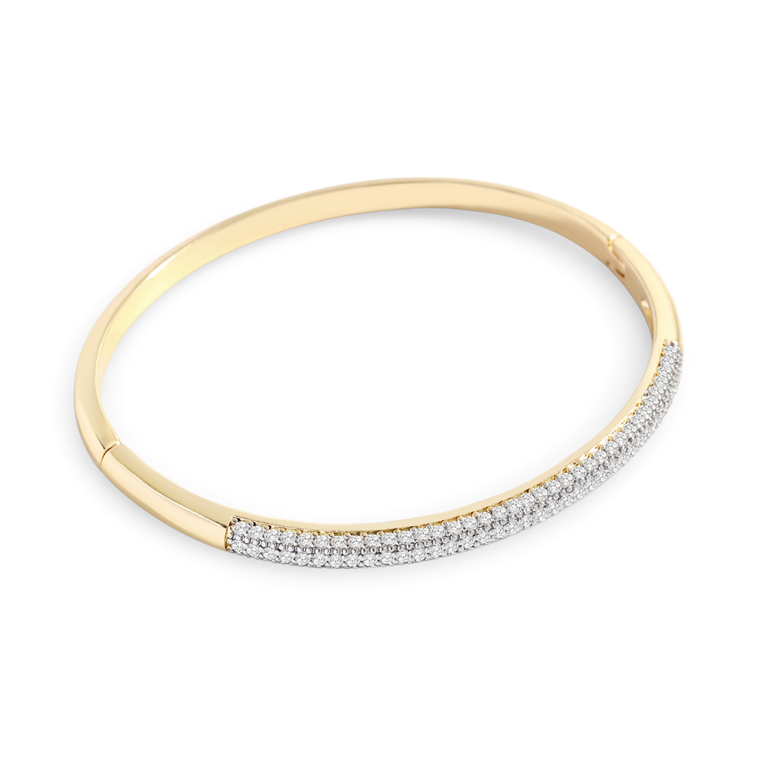 Gold bracelet with embedded diamonds on a light gray background