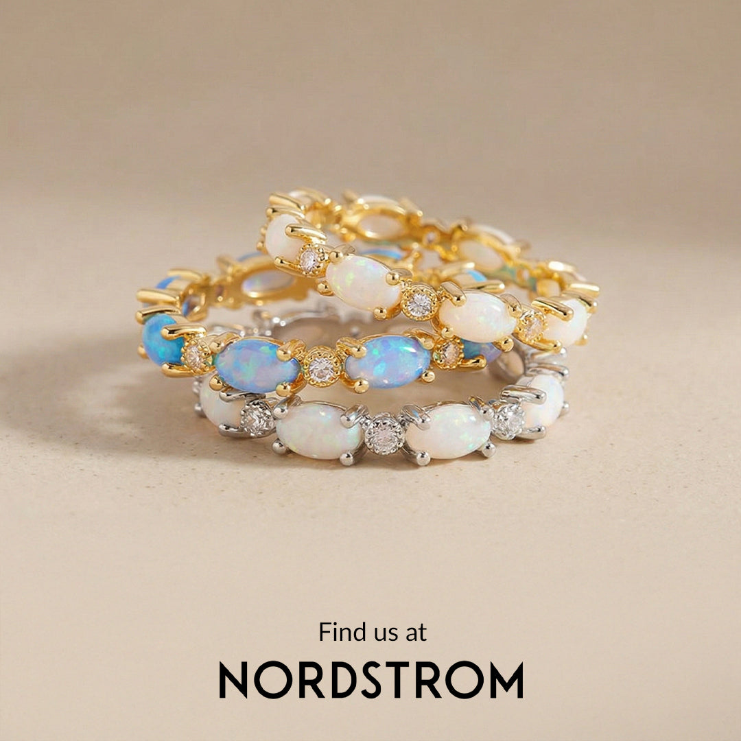 Two gold bracelets with opal stones on a beige background, featuring Nordstrom branding.