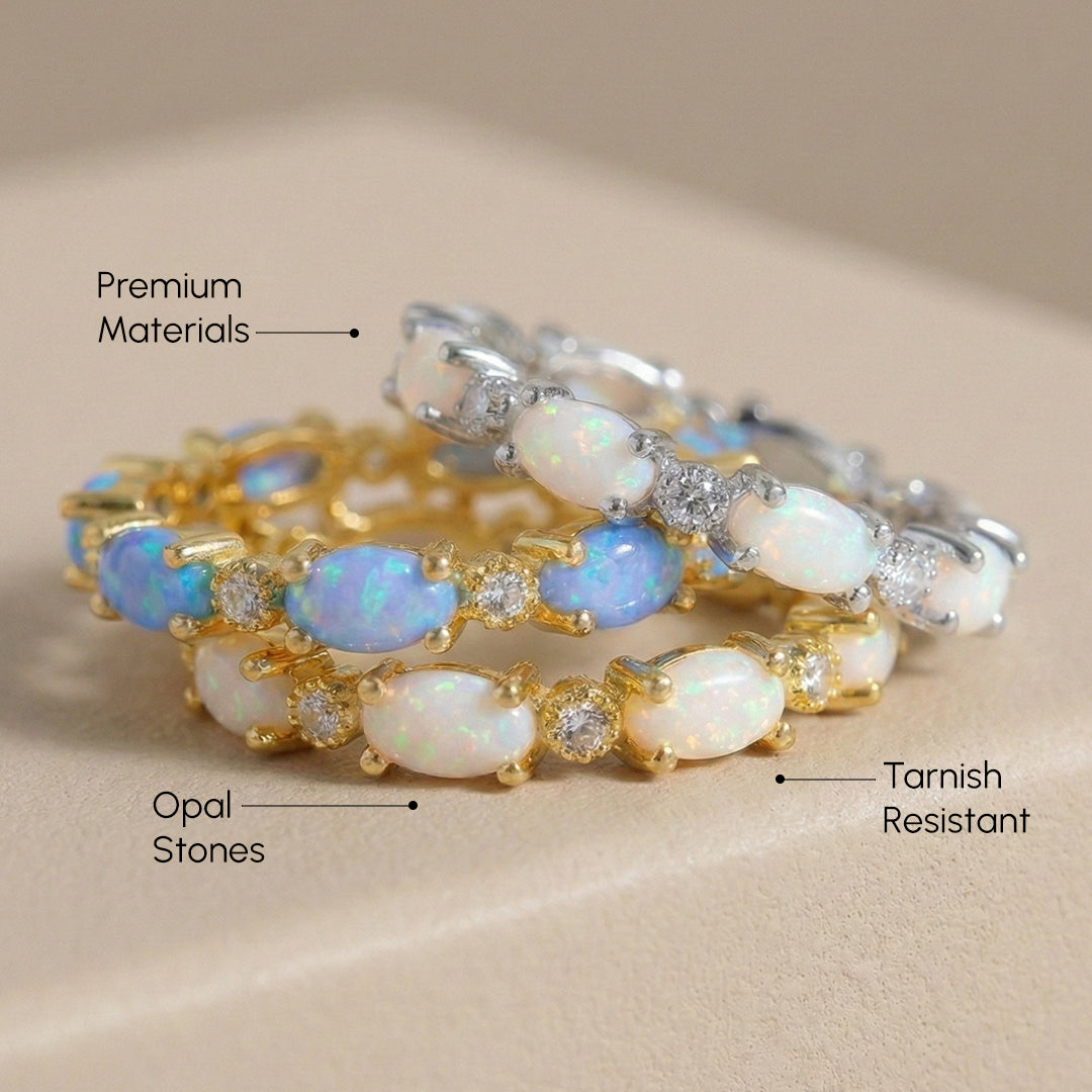 Two opal bracelets with gold and silver bands on a beige background