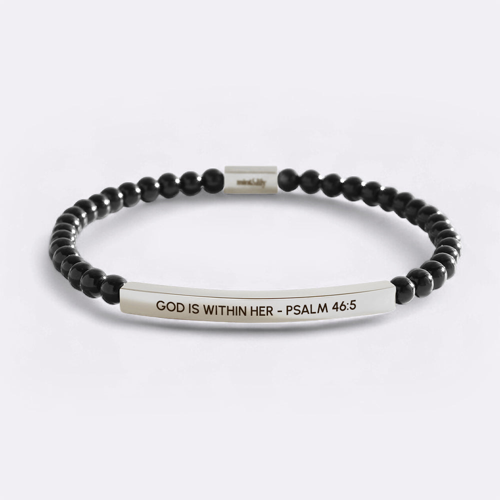 Black beaded bracelet with a silver bar featuring 'God is within her - Psalm 46:5' on a light gray background