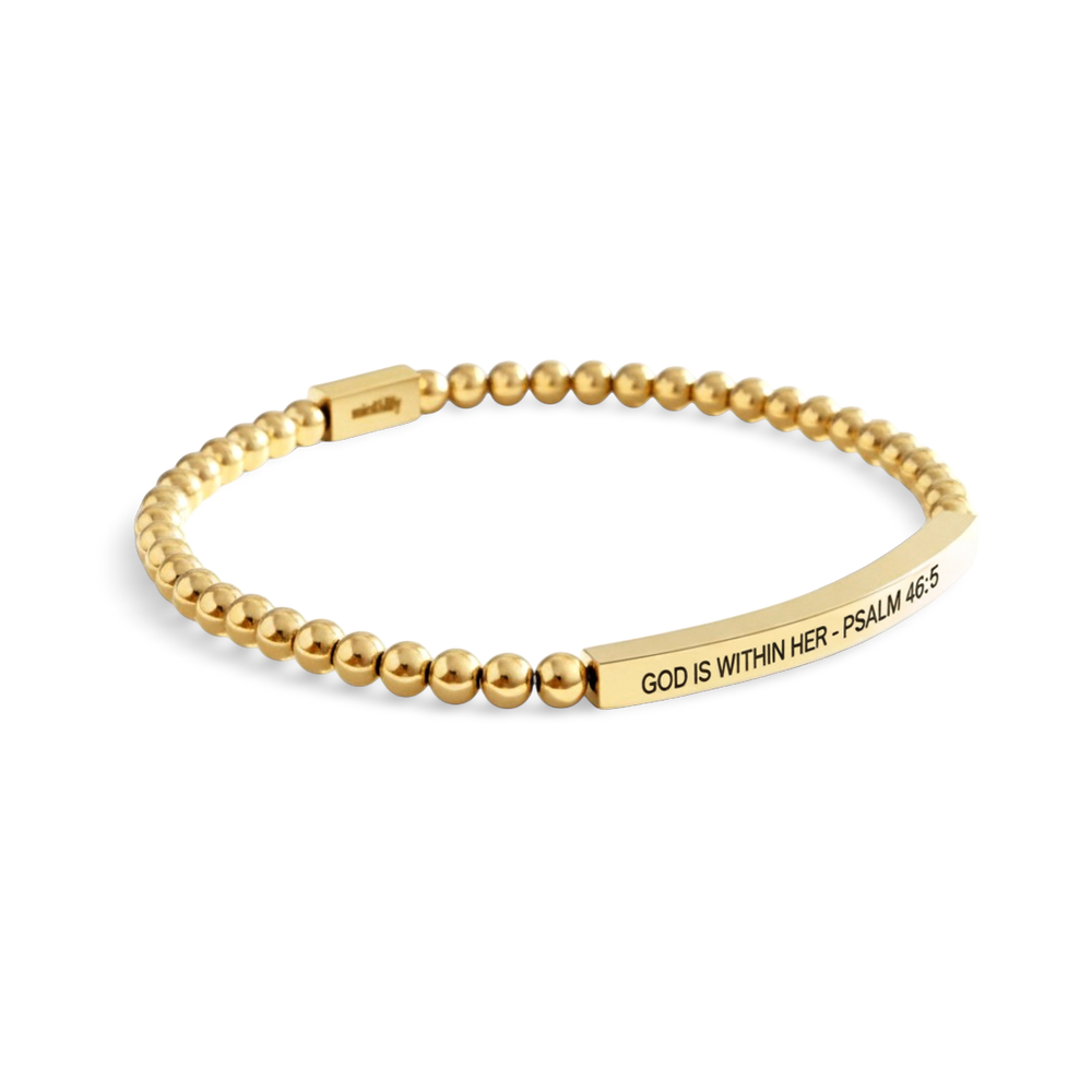 Gold beaded bracelet with engraved message on a white background