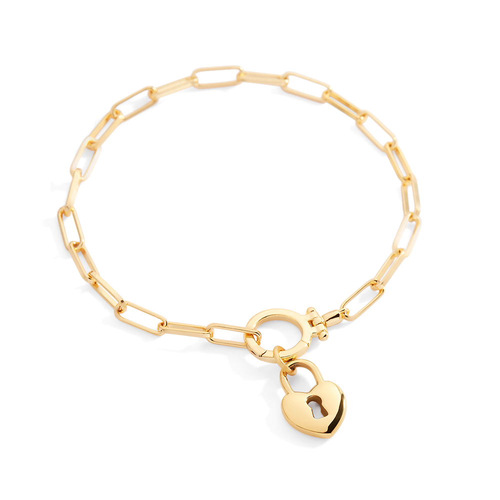 Gold bracelet with a heart-shaped padlock charm on a light gray background