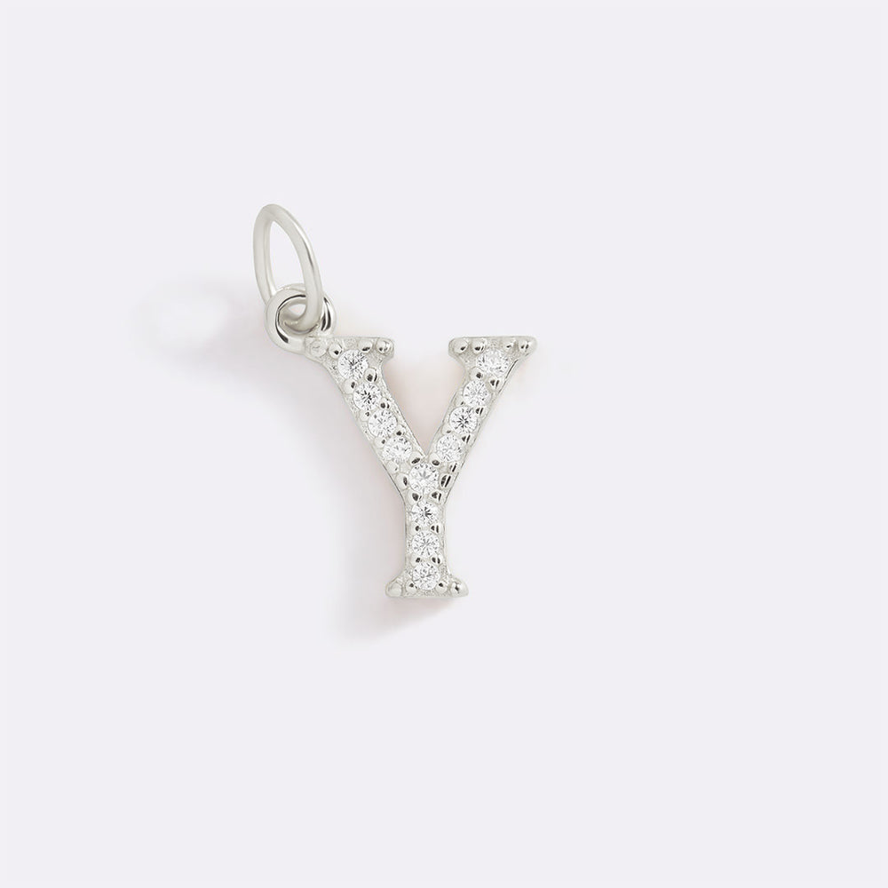 Silver letter 'Y' pendant with clear stones on a light gray background