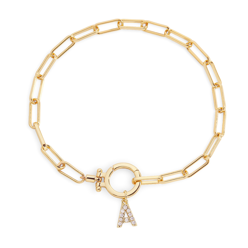 Gold chain bracelet with a charm on a white background