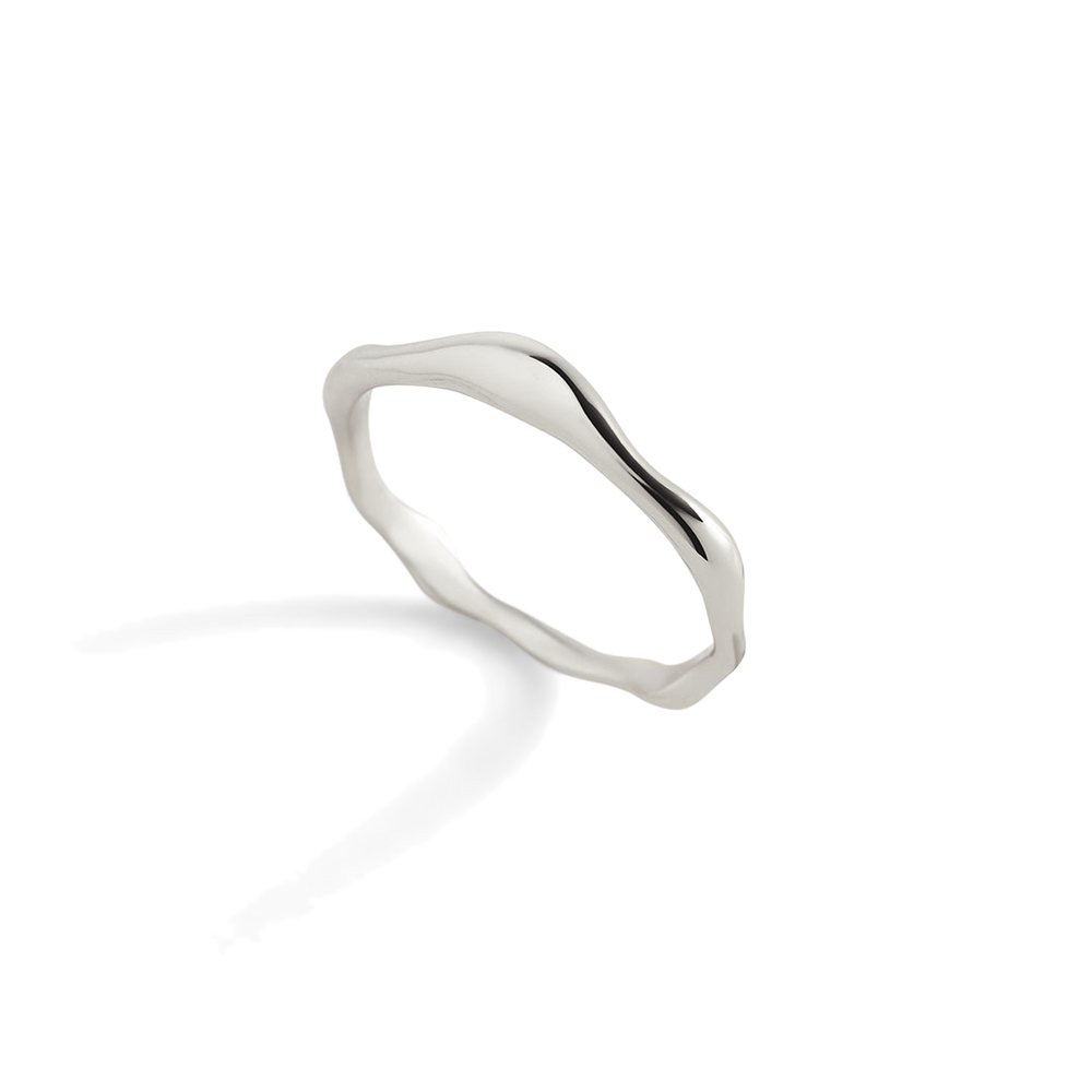 Silver ring on a light gray background