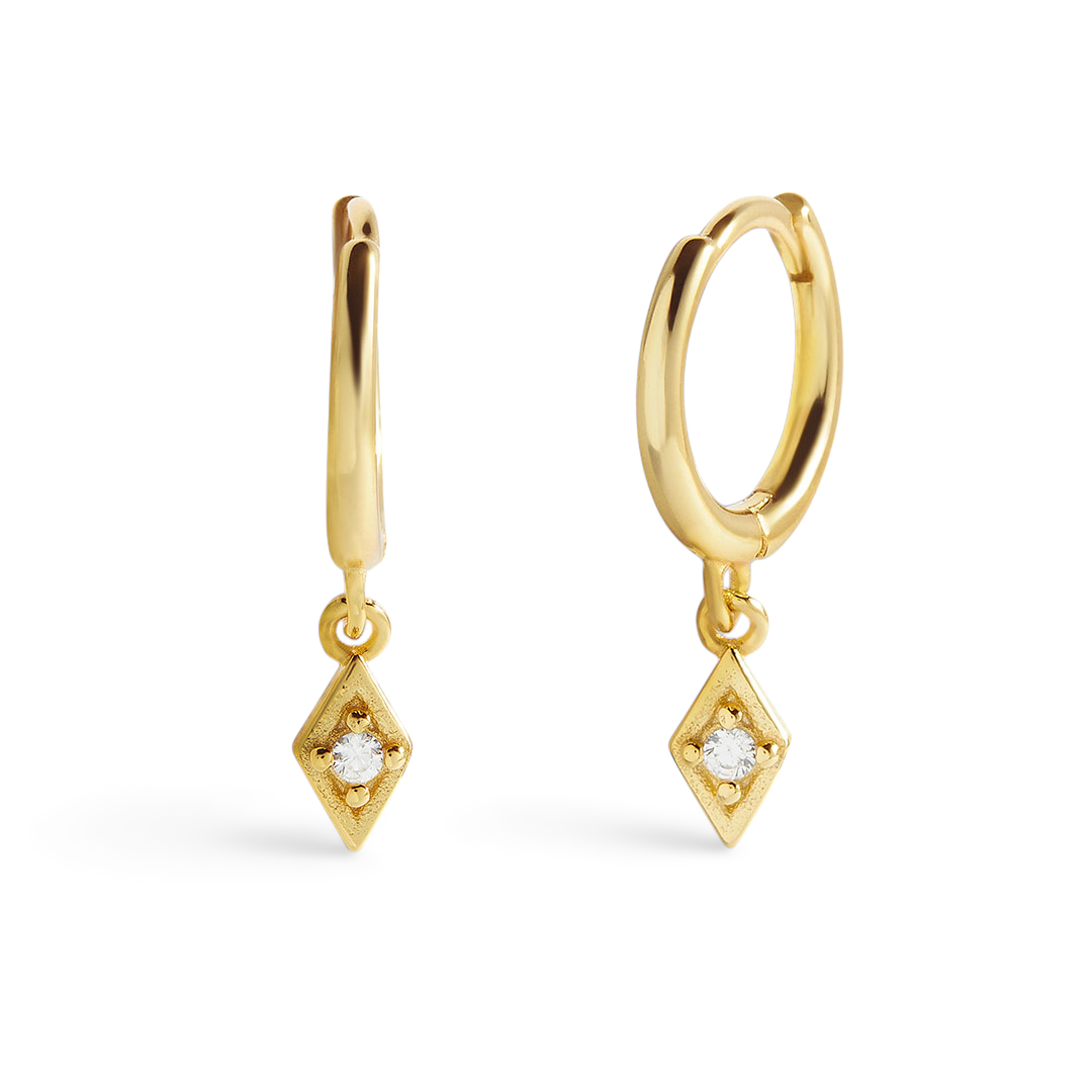 A pair of gold-colored hoop earrings with diamond charms attached to them, displayed against a black background.