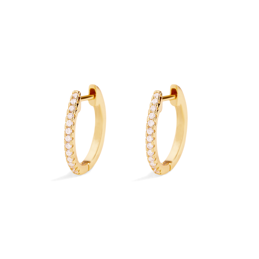 Gold hoop earrings with small diamonds on a light gray background