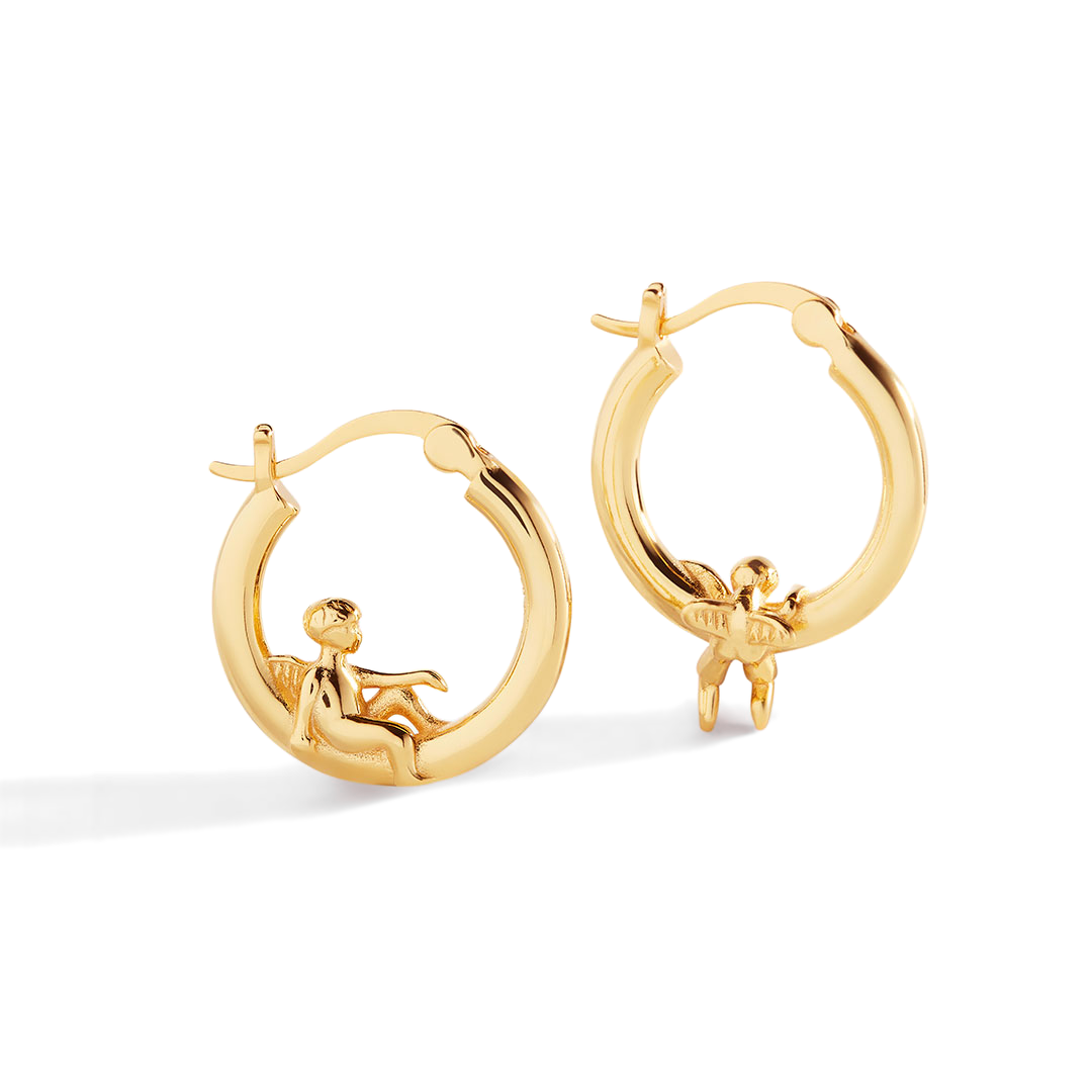 Gold hoop earrings with cherub designs on a white background