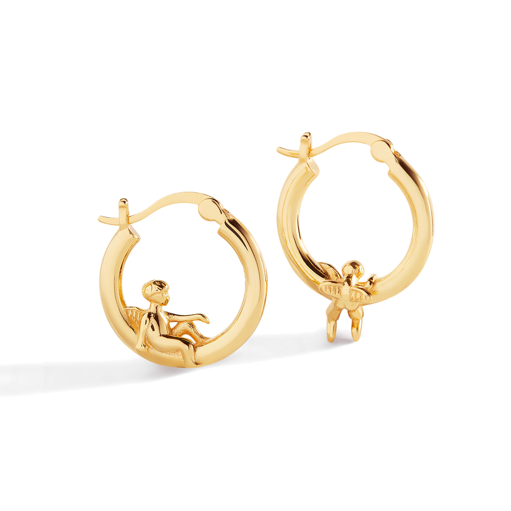 Gold hoop earrings with cherub designs on a white background
