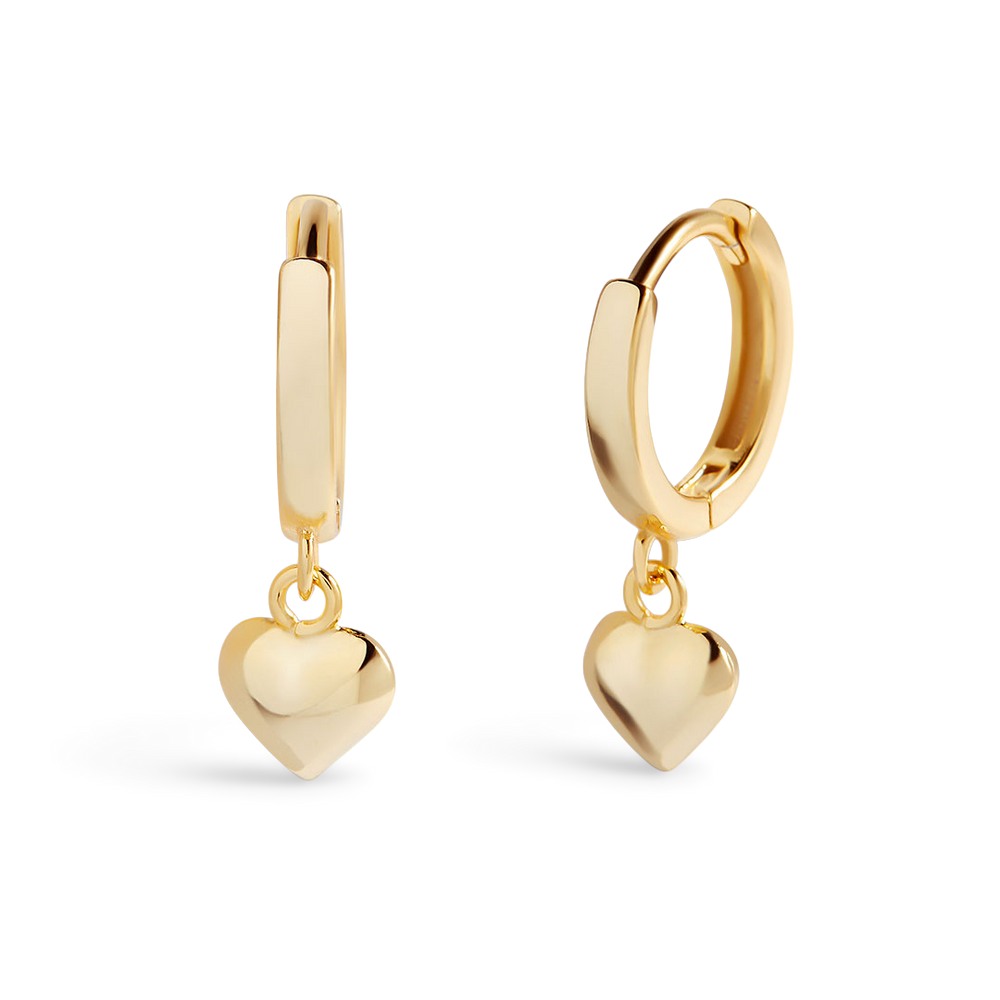 Gold hoop earrings with heart-shaped charms on a light gray background