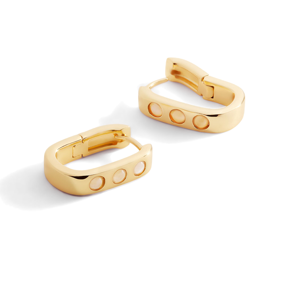 Gold hoop earrings with a minimalist design on a white background