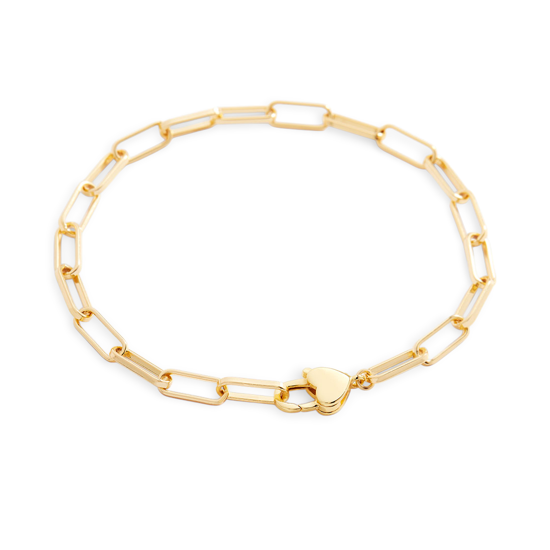 Gold chain bracelet with a heart-shaped clasp on a light gray background