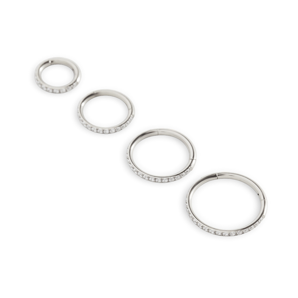 Set of silver hoop earrings on a white background