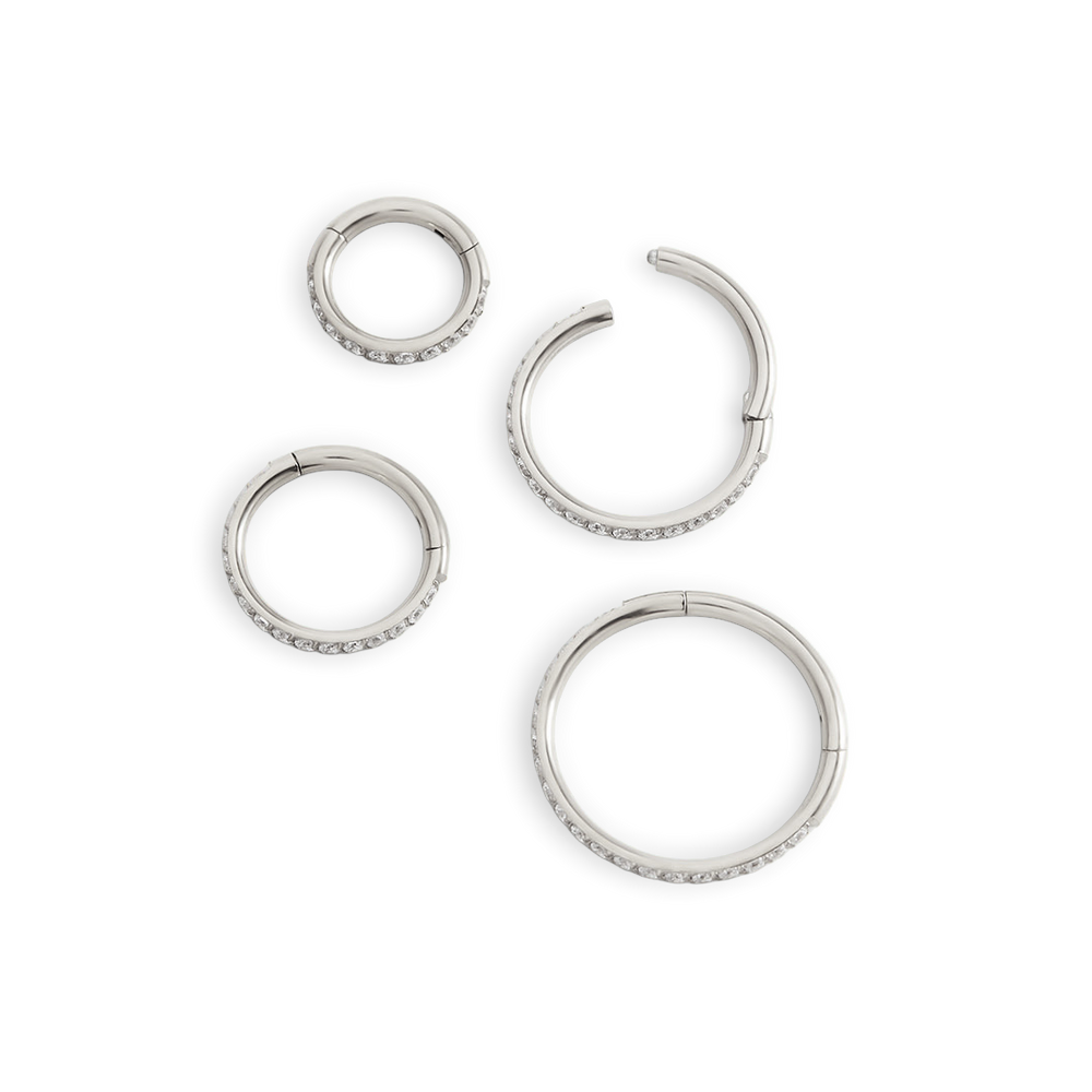 Set of silver hoop earrings on a white background