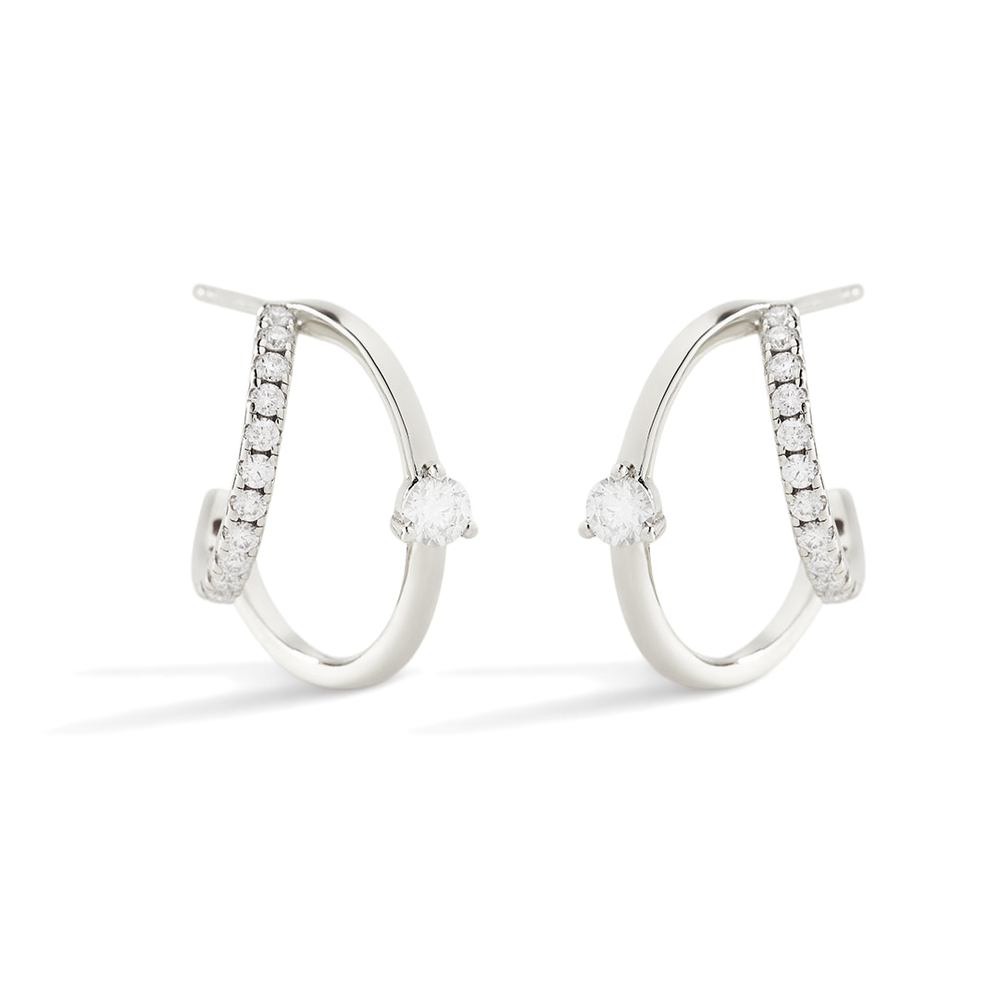 Pair of silver hoop earrings with embedded stones on a light gray background