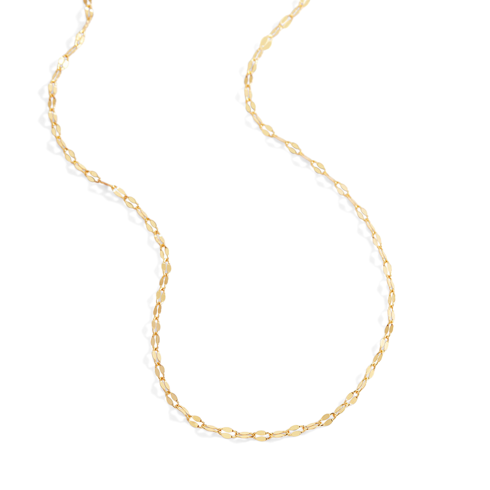 Gold chain necklace on a light gray background