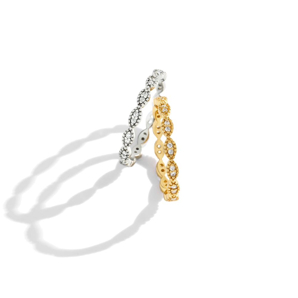 Two gold and silver rings on a white background