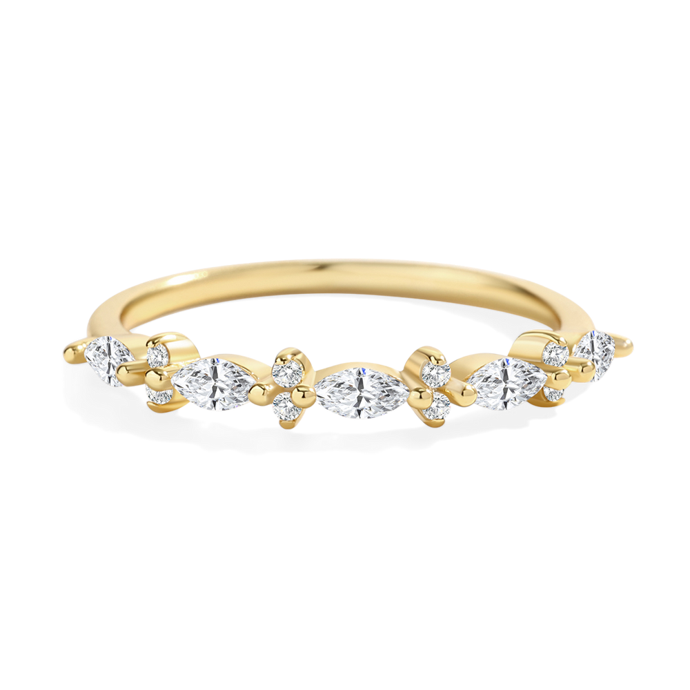 Gold ring with diamonds on a light gray background