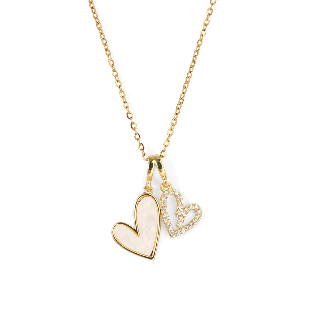 Gold necklace with a heart-shaped pendant on a white background