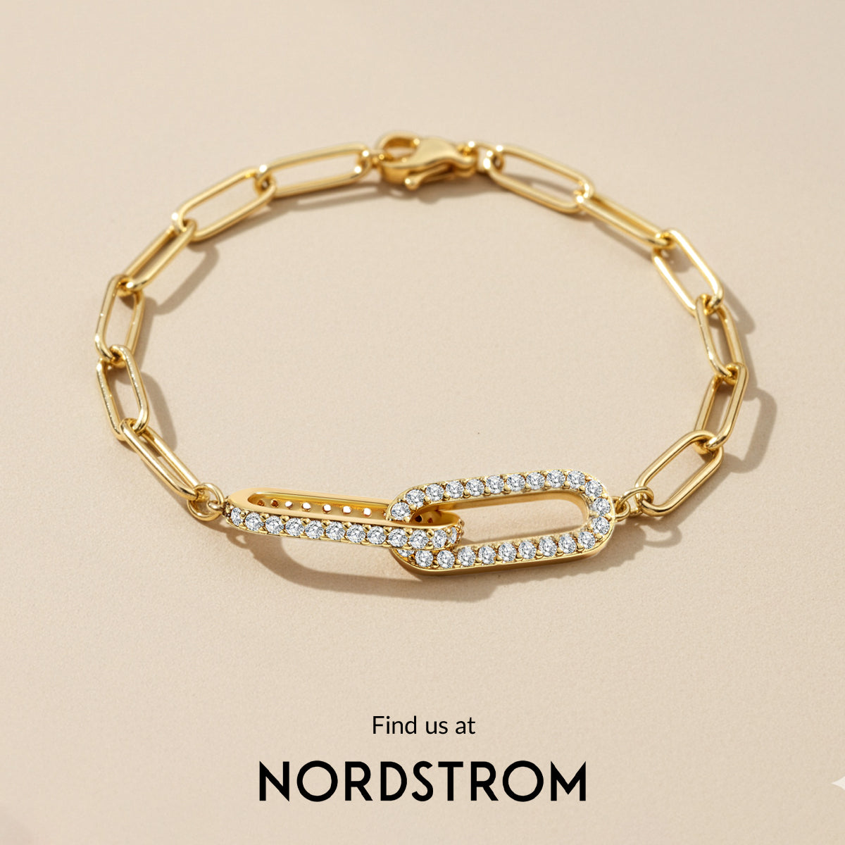 Gold chain bracelet with diamond accents on a beige background, Nordstrom branding visible.