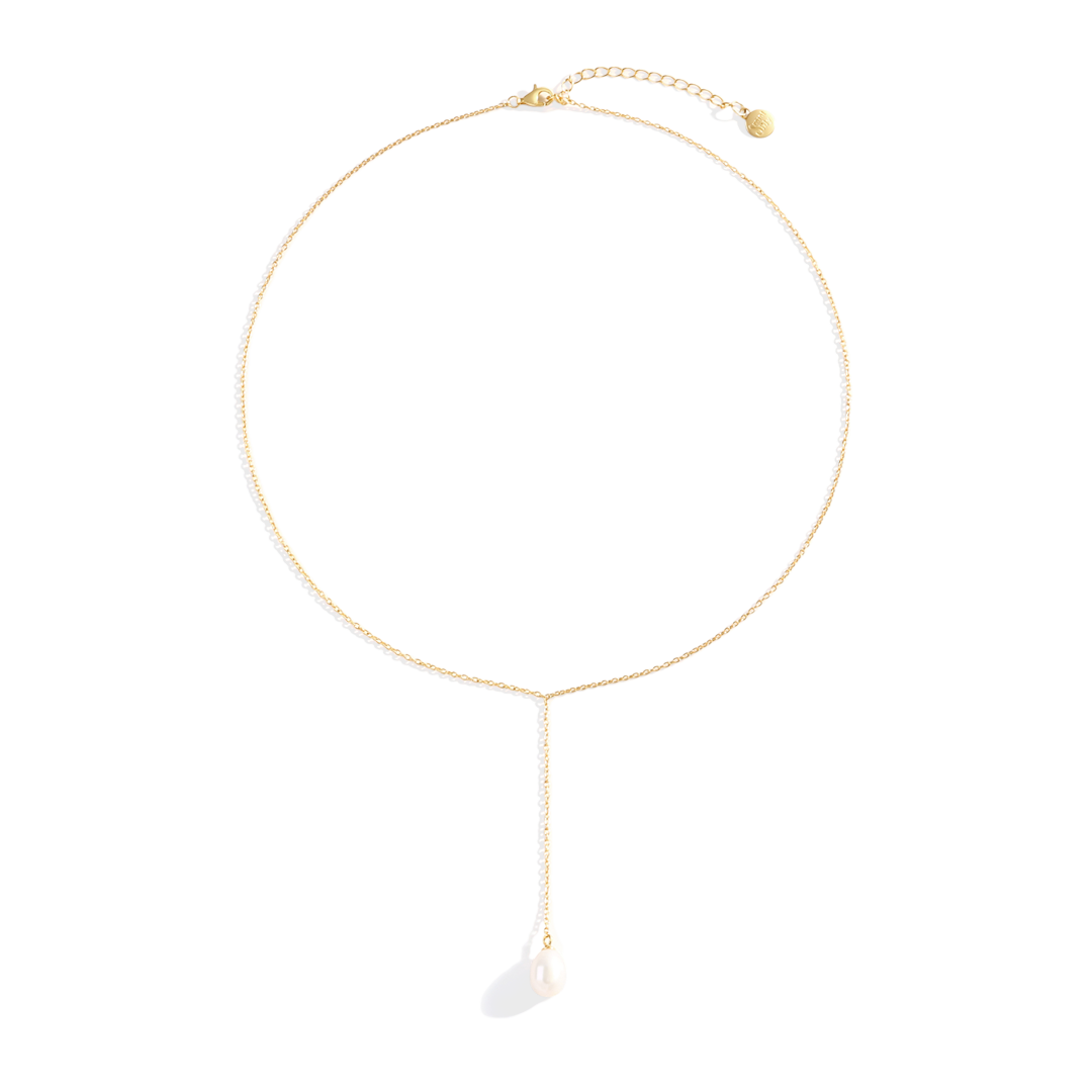 Gold necklace with a small pendant on a white background