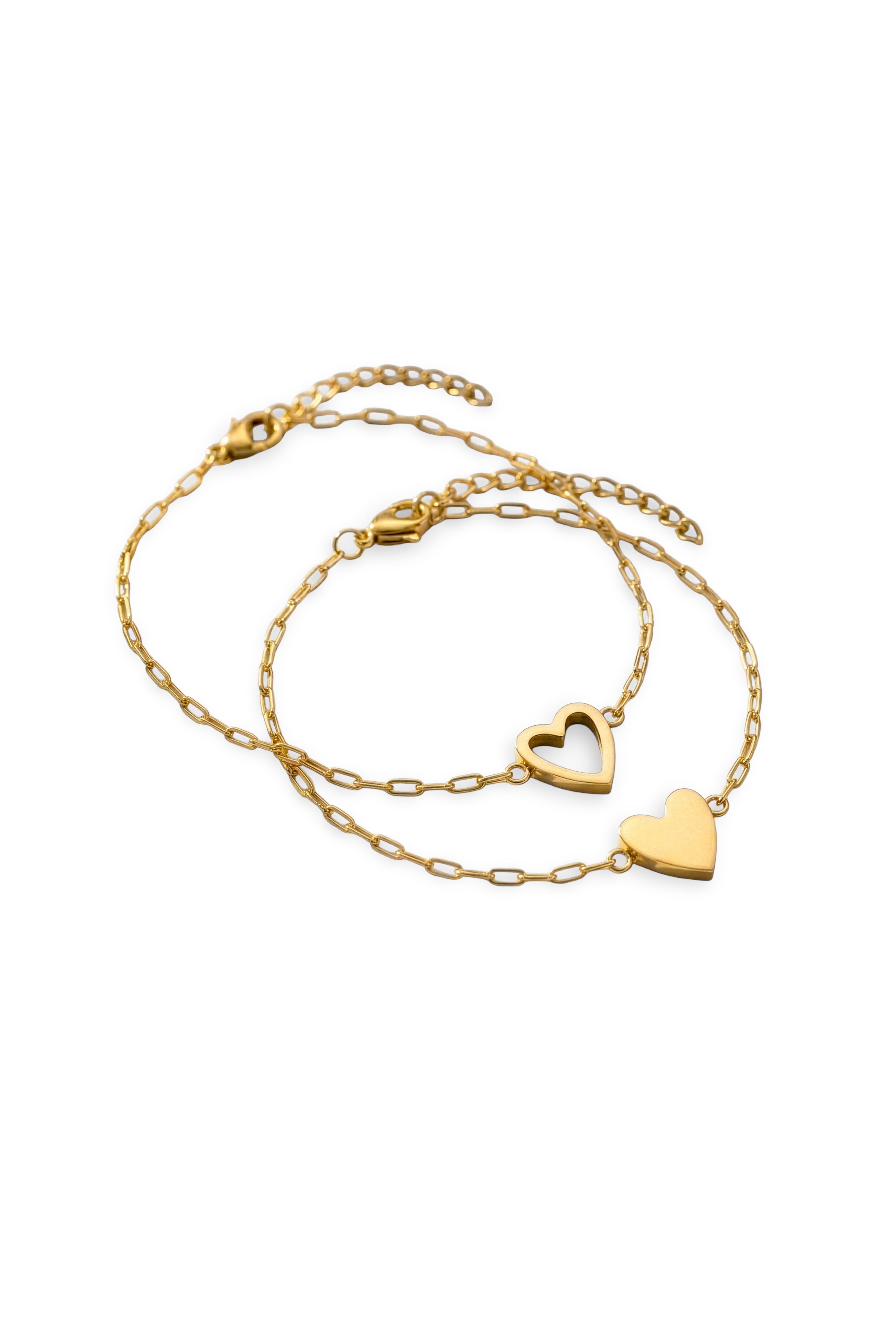 Two gold heart-shaped necklaces on a white background