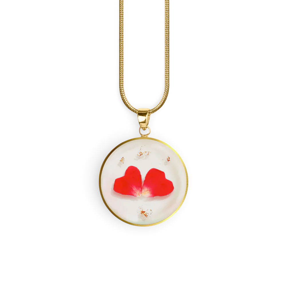 Necklace with a round pendant featuring red flowers on a white background