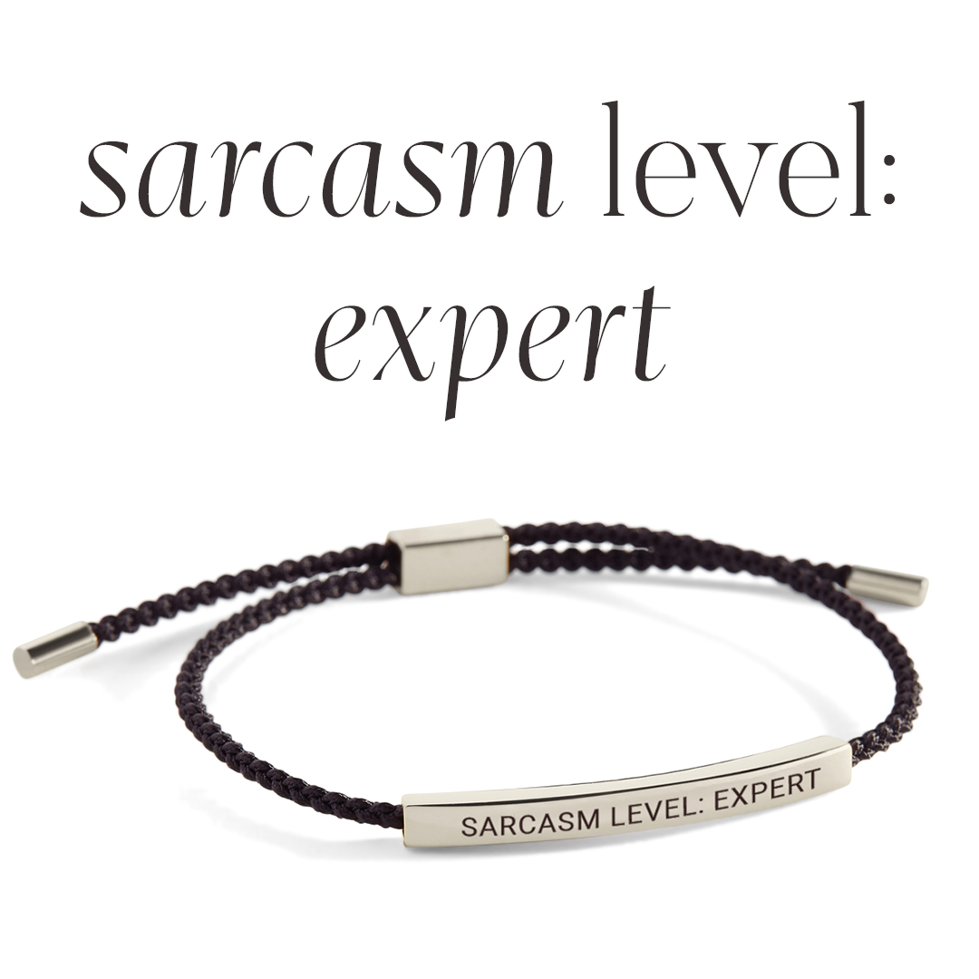 Bracelet with 'Sarcasm Level: Expert' text on a light gray background