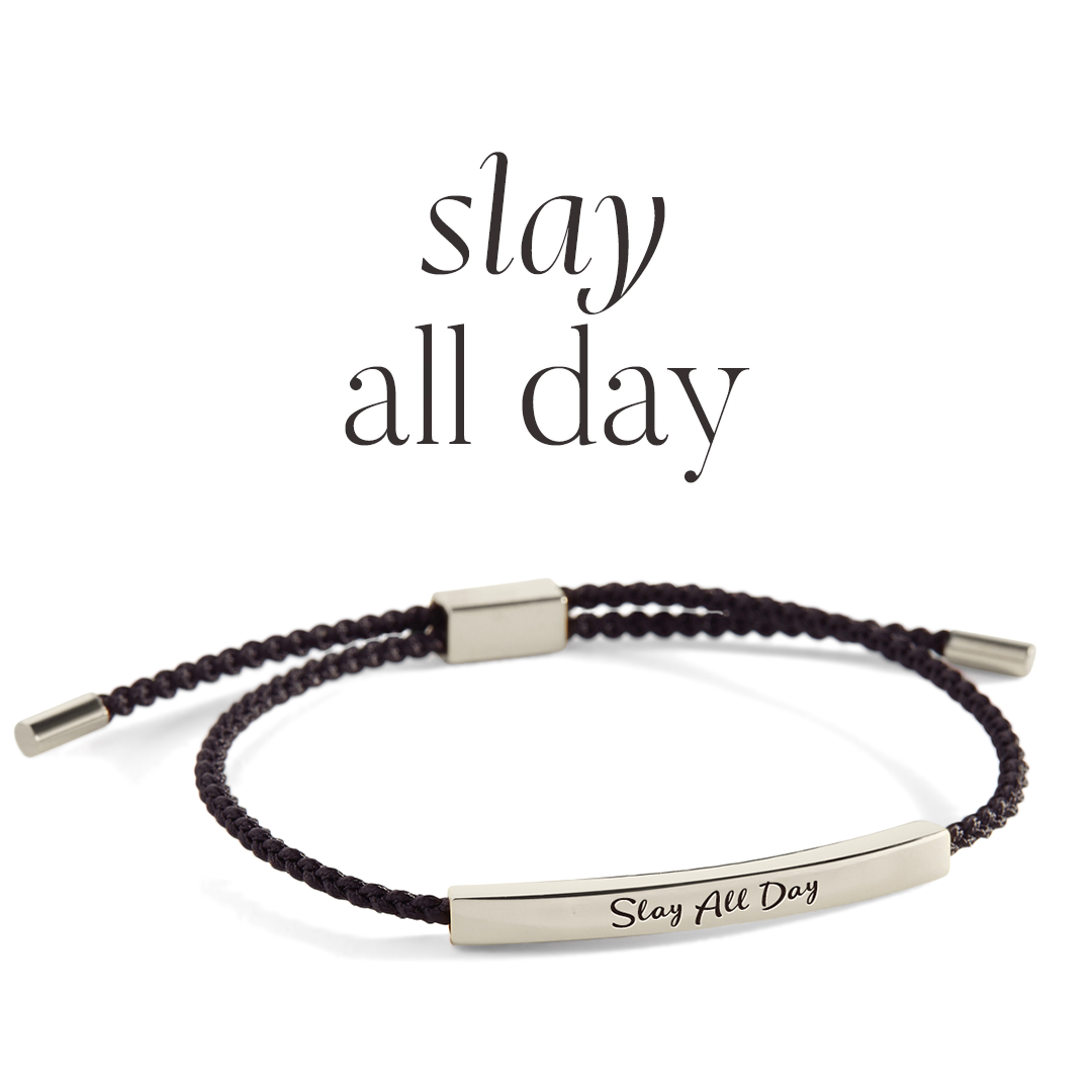 Bracelet with 'Stay All Day' engraving on a light background