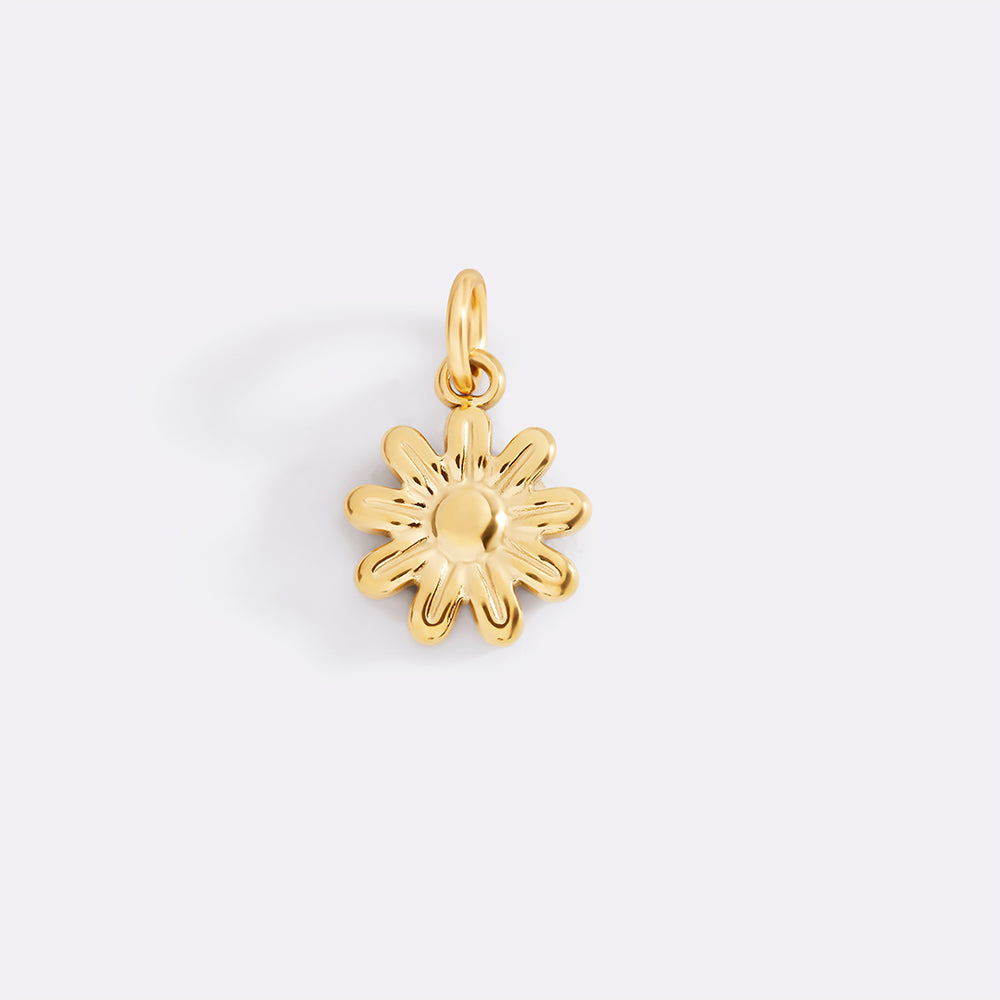 Gold flower-shaped pendant on a light gray background