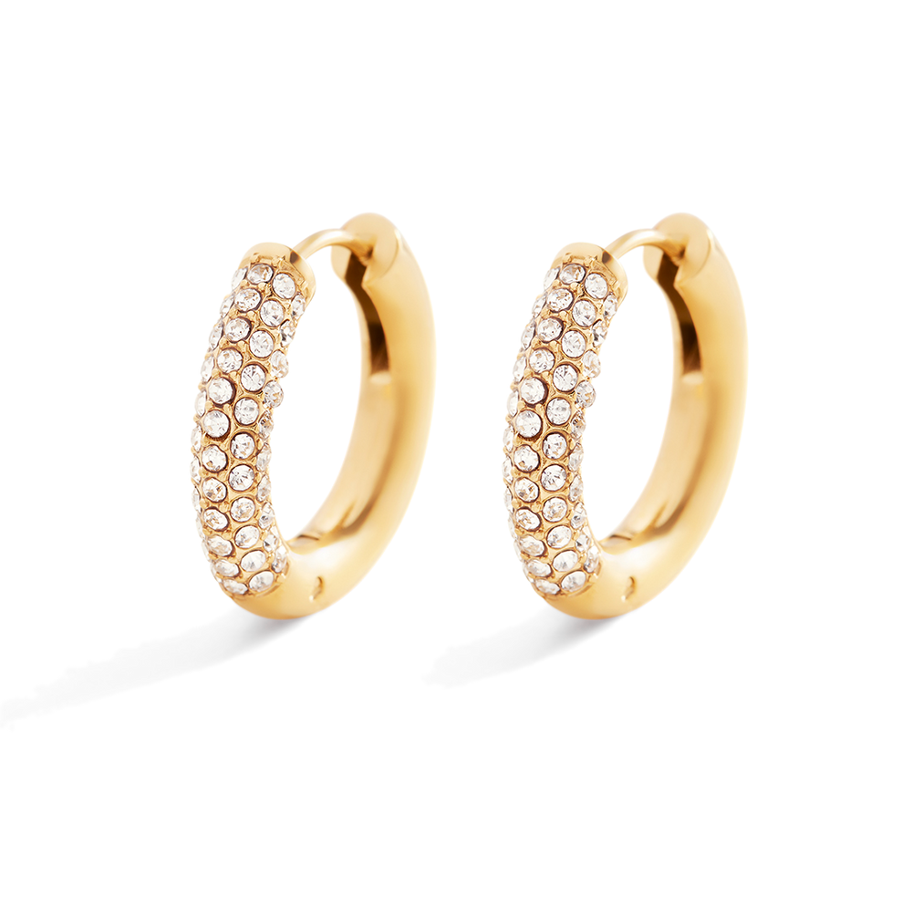 Gold hoop earrings with embedded stones on a light gray background