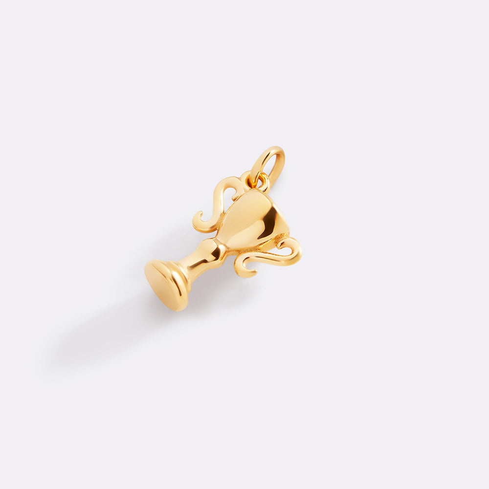 Gold trophy-shaped pendant on a white background