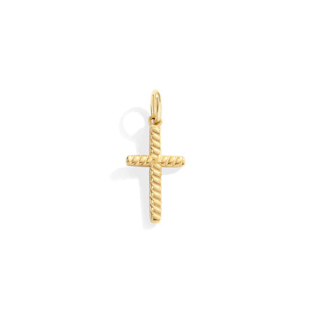 Gold cross pendant on a white background
