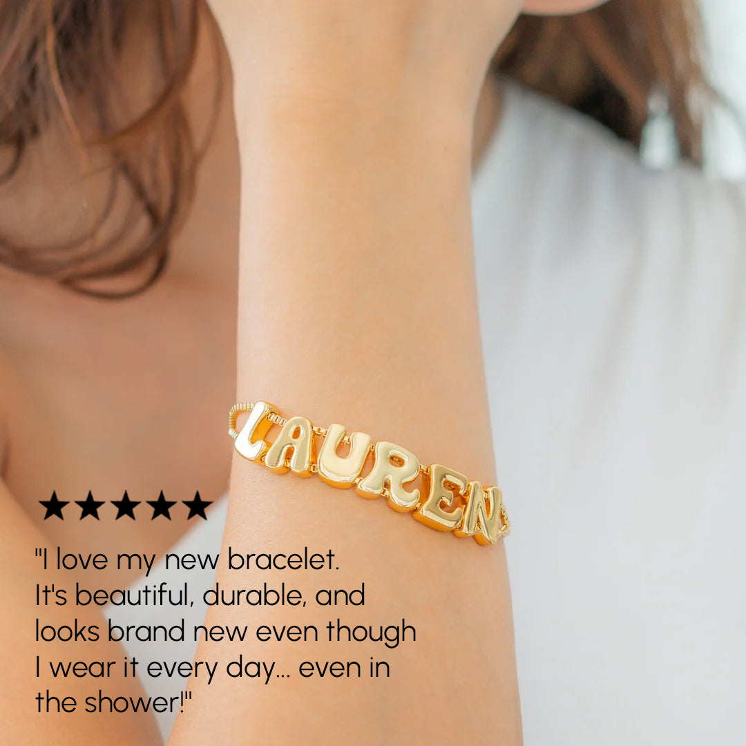 Gold bracelet with 'LAUREN' on a wrist, with a five-star rating and customer review text.